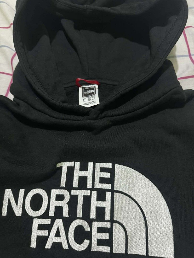 The North Face Black Hoodie (Category: Hoodies) located in San Juan City. Submitted by che2x22 (Listing ID 1414660515, Image 2). Description: -youth/junior medium - The North Face kids' hoodie - Color: Black - Features a hood and front pocket - The North Face logo on the front - Includes original tag -used once during our HK Trip (personal used).