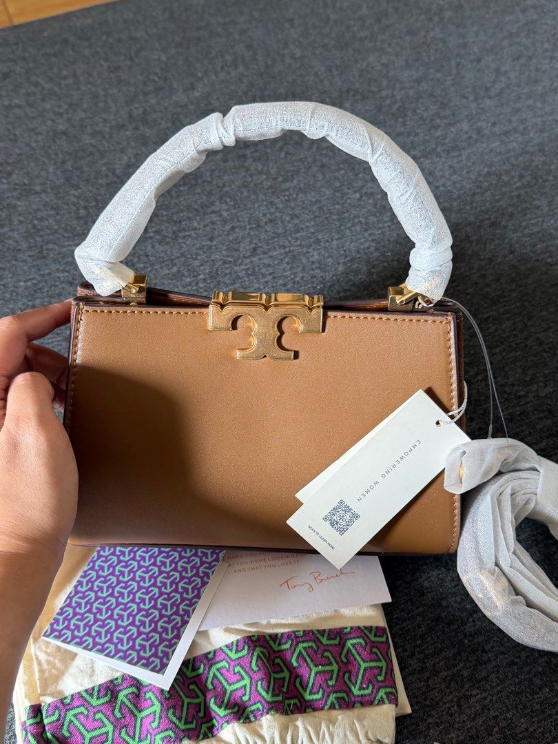 Tory Burch Eleanor Mini Satchel (Category: Luxury Bags & Wallets) located in Quezon City. Submitted by ayasofetch25 (Listing ID 1414654543, Image 3). Description: - Authentic Tory Burch Eleanor Mini Satchel bag - Color: Tan - Features: - Top handle - Gold-tone logo - Detachable strap - Multiple interior compartments - Protective wrapping on handle - Includes: Dust bag, tags, and cards.