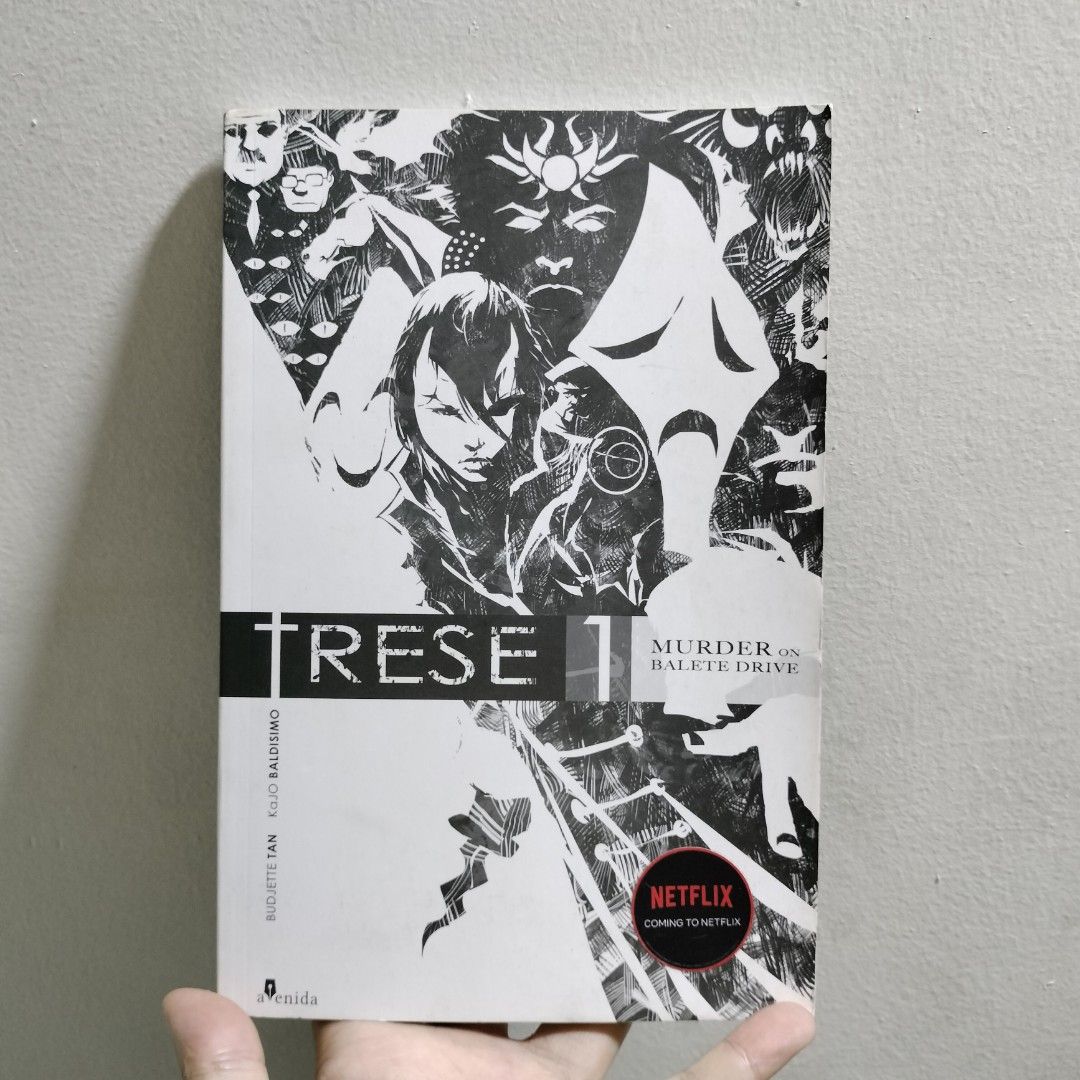 TRESE: Murder on Balete Drive (Volume 1) (Category: Storybooks) located in Antipolo. Submitted by serjyms (Listing ID 1414722927, Image 1). Description: TRESE: Murder on Balete Drive (Volume 1) Budjette Tan & KaJO Baldisimo 19th Avenida Publishing House 2021, Paperback, 116 pages Selling Price: Php149+sf Location: Antipolo City, Rizal Condition: Good Condition ( Issue: water stain on first three pages) Mode of Payment: Gcash Mode of Delivery: J&T