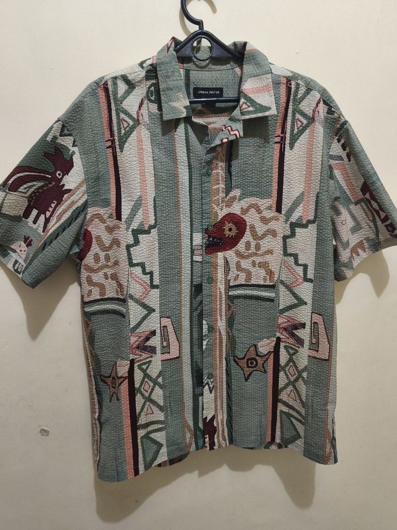 Urban Revivo Printed Shirt (Category: Tshirts & Polo Shirts ) located in Manila. Submitted by cinnamonboy24 (Listing ID 1414657075, Image 2). Description: - Urban Revivo shirt -Used only twice during beach trips in Boracay and Romblon - Unique Mayan printed design - Button-down front - Short sleeves - Textured fabric - Relaxed fit - Size: M/L.
