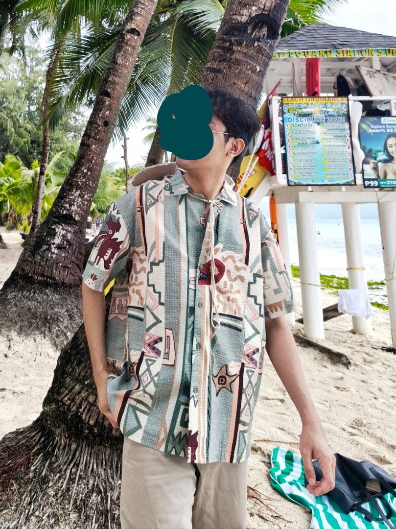 Urban Revivo Printed Shirt (Category: Tshirts & Polo Shirts ) located in Manila. Submitted by cinnamonboy24 (Listing ID 1414657075, Image 1). Description: - Urban Revivo shirt -Used only twice during beach trips in Boracay and Romblon - Unique Mayan printed design - Button-down front - Short sleeves - Textured fabric - Relaxed fit - Size: M/L.