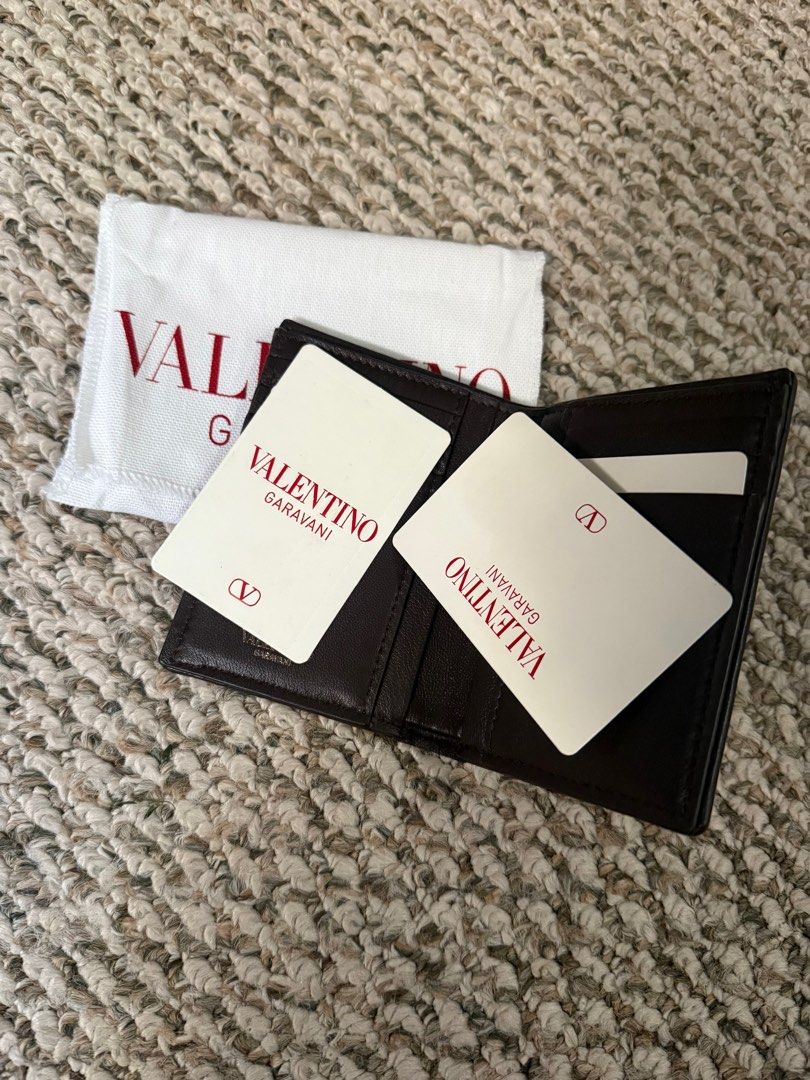 Valentino Garavani Canvas Wallet (Category: Luxury Bags & Wallets) located in Manila. Submitted by Authentic_Seller (Listing ID 1414665332, Image 2). Description: Valentino Garavani wallet Unique canvas design with brand logo Complete: Includes dust bag and cards Multiple card slots -6 Brown leather trim Brand new and complete inclusions with Box.
