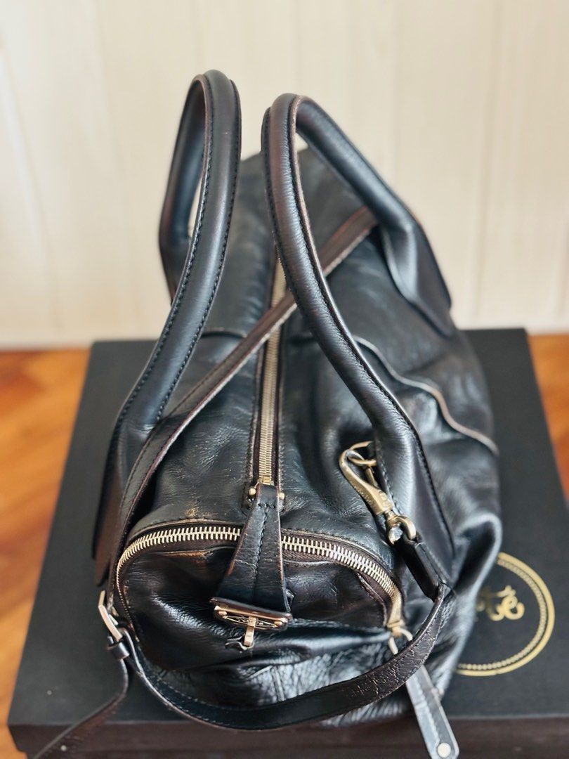 Vintage Tod's D Bag (Category: Luxury Bags & Wallets) located in Taguig. Submitted by marjorieco (Listing ID 1414669173, Image 2). Description: No cracks in leather. Some Color fading is visible as the bag was Re-colored to black by Vintage Restore. Original color was khaki. .