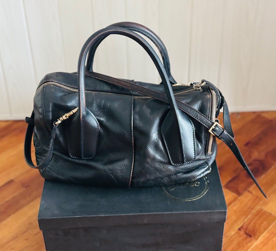 Vintage Tod's D Bag (Category: Luxury Bags & Wallets) located in Taguig. Submitted by marjorieco (Listing ID 1414669173, Image 1). Description: No cracks in leather. Some Color fading is visible as the bag was Re-colored to black by Vintage Restore. Original color was khaki. .