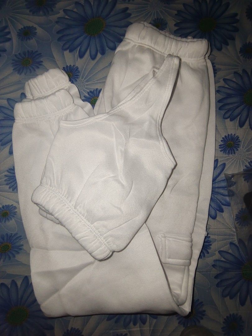 White Track Pants Set (Category: Sets or Coordinates) located in Manila. Submitted by declutterwithpassion (Listing ID 1414714839, Image 2). Description: - White tracksuit set - Includes a crop top and matching pants - Pants feature a cuffed ankle design - Made of soft material - Ideal for casual wear and lounging RFS: decluttering issue: need wash #declutter2026.