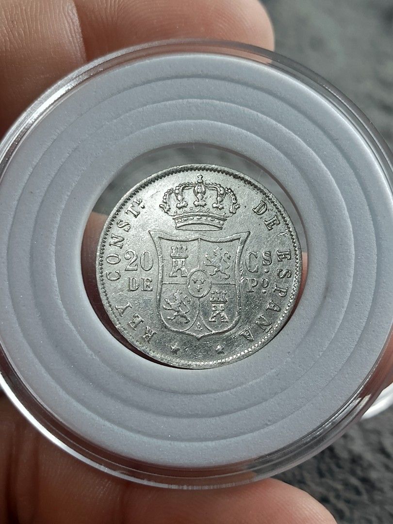 1883 20cs Spanish Coin Alfonso (Category: Currency) located in Quezon City. Submitted by Coiners (Listing ID 1414964596, Image 2). Description: - 1883 Alfonso XII Coin - Features King Alfonso XII's profile - Displays a coat of arms - Made of silver - Includes protective holder.