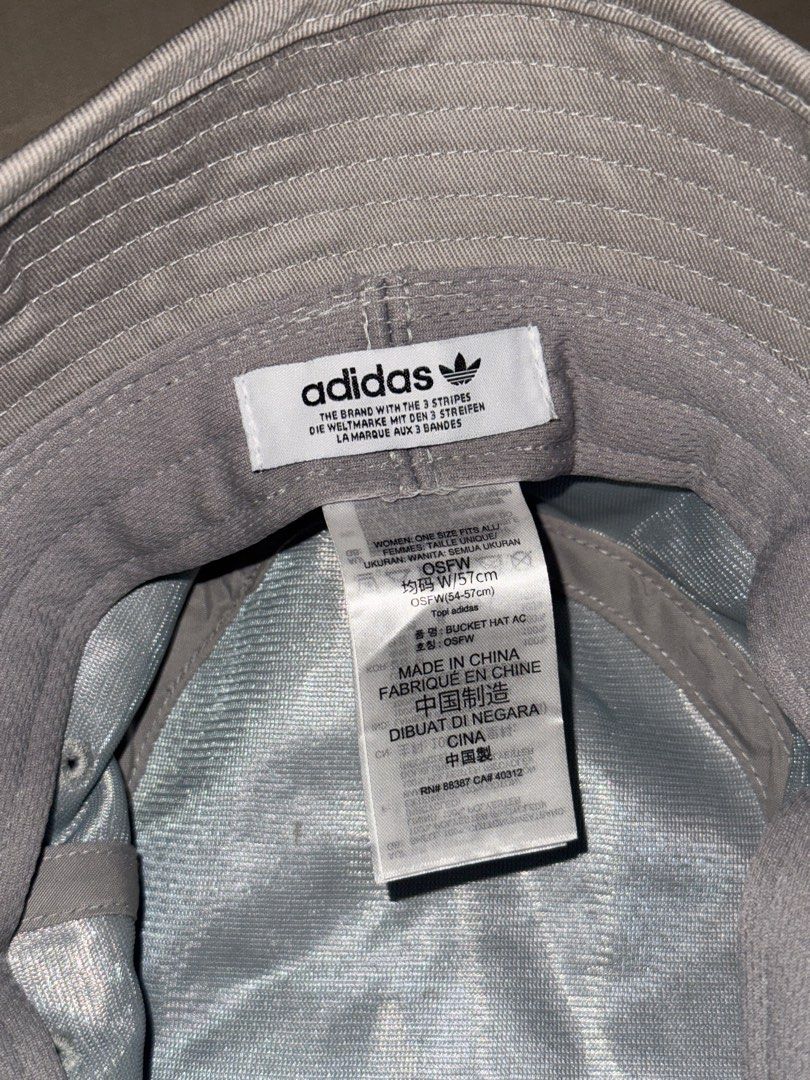 Adidas Bucket Hat (Category: Hats & Beanies) located in Manila. Submitted by stuffbyabby (Listing ID 1414976769, Image 2). Description: AVAILABLE AND LAST PRICE na. Low ballers will be ignored. If hindi afford, wag na mag inquire. Don’t waste time asking if available pa. It’s available as long as this post is not marked sold and interested buyers haven’t paid. RFS: Decluttering - Original Adidas bucket hat - Color: Grey - Features the Adidas tref