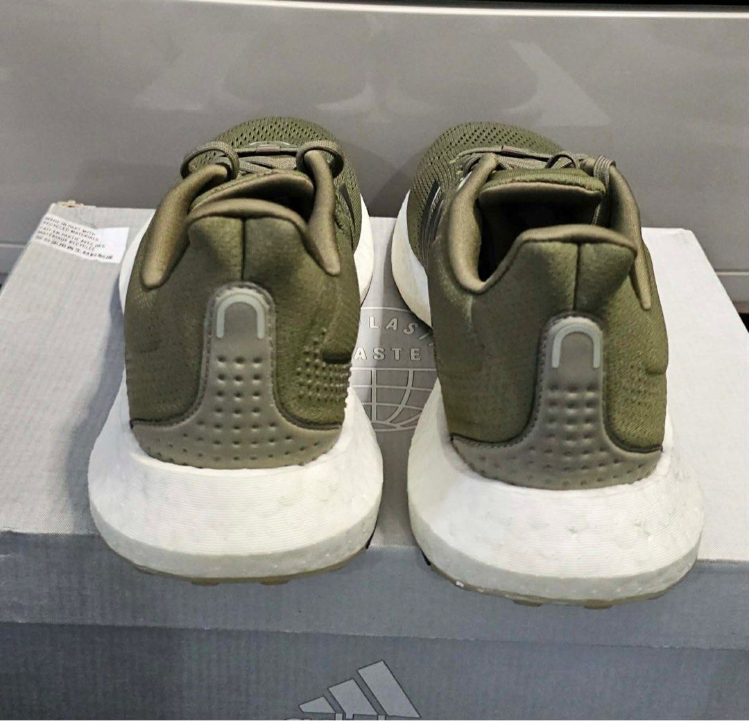 Adidas Pureboost 21 Olive Running Shoes (Category: Sneakers) located in Quezon City. Submitted by tinperen (Listing ID 1414930133, Image 3). Description: - Adidas running shoes - Color: Olive green - Adidas logo on tongue and side - White sole with black accents - Includes original box - Box features "End Plastic Waste" logo ₱ 3,500 Location: Veterans Village Pasong Tamo QC Pin: Northern Legends Hobby Shop MOP: Gcash, BDO, BPI, COD Shipping: Lala