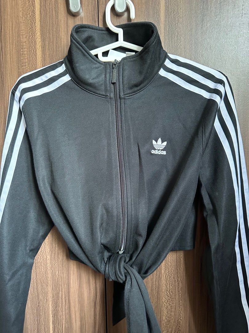 Adidas Track Jacket with 3 Stripes (Category: Coats, Jackets and Outerwear) located in Tagbilaran City. Submitted by icedcoconutlatte (Listing ID 1414897469, Image 3). Description: - Used once only - No flaws - Adidas black track jacket - White stripes on sleeves - Cropped style - Size: XS/TP - Full zip closure - Adidas logo on chest and zipper - Made in China.