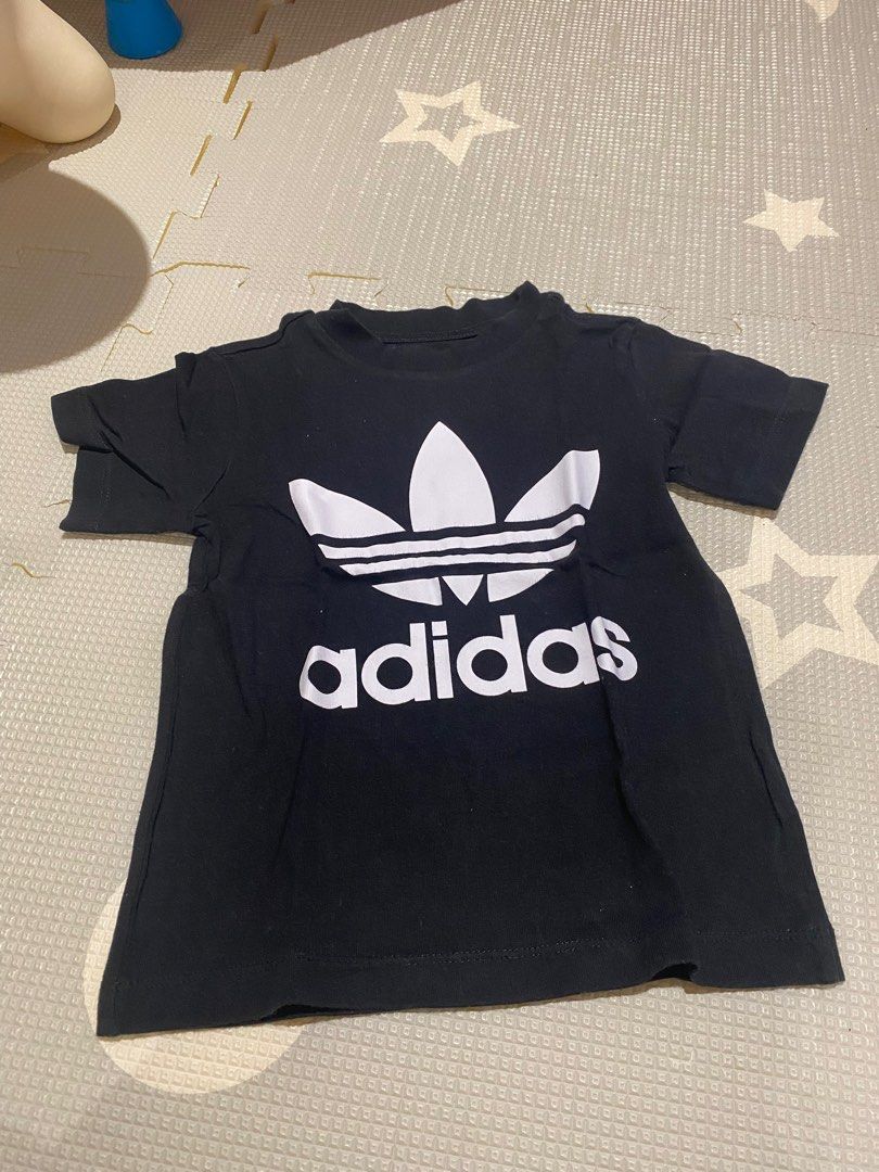 Adidas Trefoil T-shirt (Category: Babies & Kids Fashion) located in Quezon City. Submitted by luca25 (Listing ID 1414864876, Image 1). Description: - authentic Adidas Trefoil T-shirt - Size: 3T (2 to 3 on tag) - Color: Black shirt with white logo - Features the iconic Adidas logo - Short sleeves and crew neck - Made in Pakistan - bought in Shang mall.