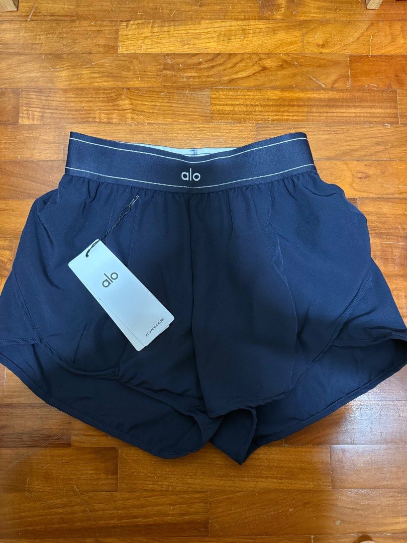 Alo Tagged Shorts (Category: Activewear) located in Singapore. Submitted by asd_26 (Listing ID 1414858486, Image 1). Description: Do not ask about the authenticity. Got it from TB. Great for everyday wear. Suitable for S size ladies. 1 for 18.Get both for 30. Black - Sold Blue - Avail.