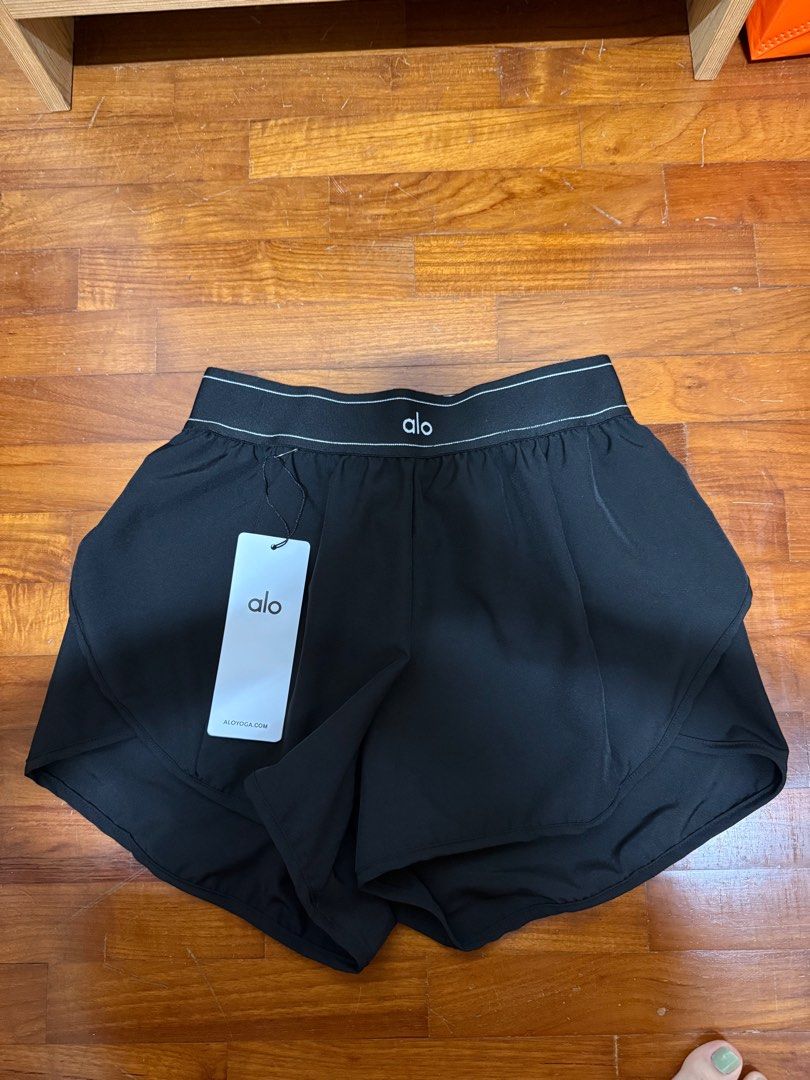 Alo Tagged Shorts (Category: Activewear) located in Singapore. Submitted by asd_26 (Listing ID 1414858486, Image 3). Description: Do not ask about the authenticity. Got it from TB. Great for everyday wear. Suitable for S size ladies. 1 for 18.Get both for 30. Black - Sold Blue - Avail.