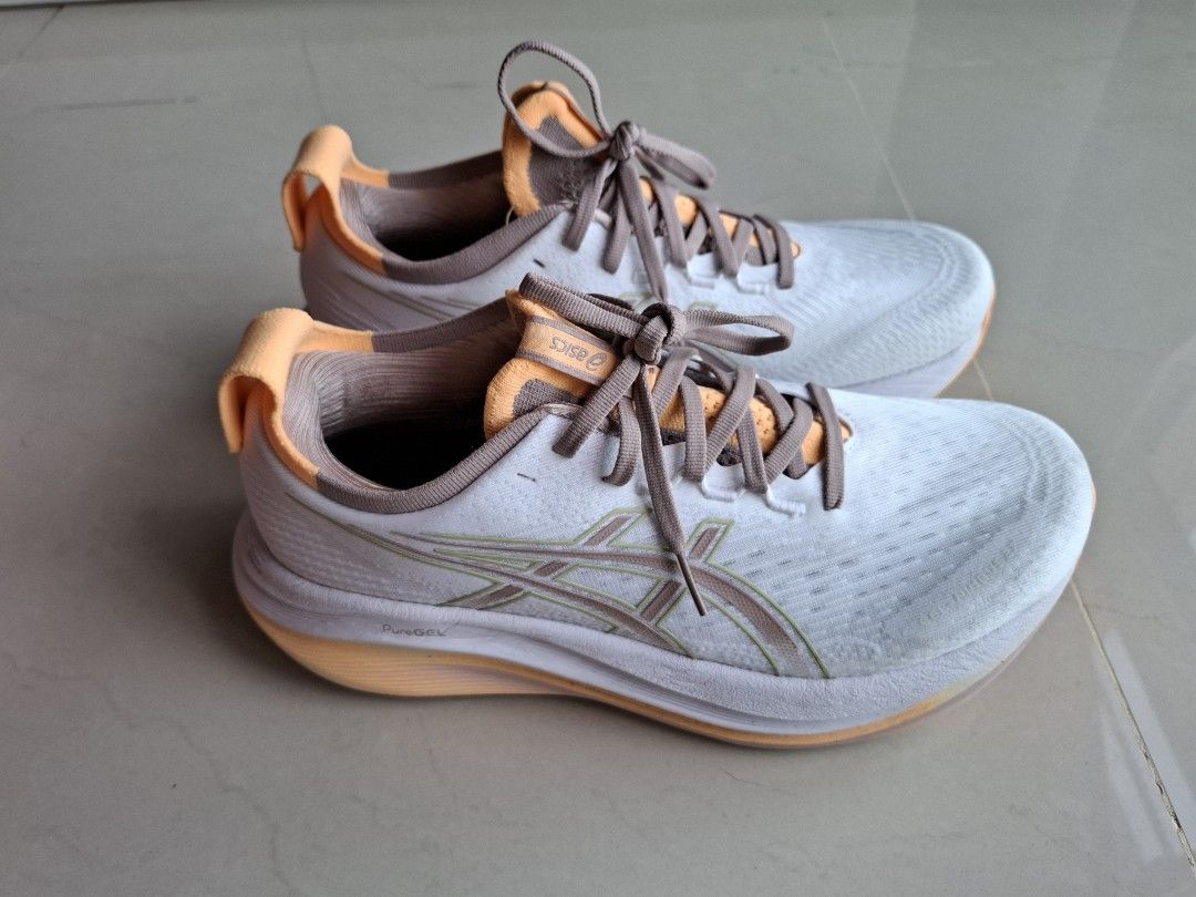 ASICS Gel-Nimbus27 Womens Running Shoes - US 8.5 (Category: Sneakers) located in Singapore. Submitted by danpty (Listing ID 1414928113, Image 3). Description: - ASICS Gel-Nimbus 27 - Size: US 8.5 - Color: White and Orange - Condition: Excellent.