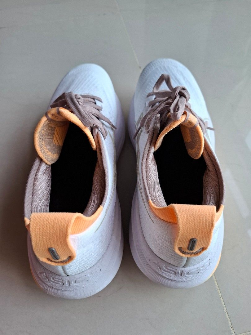 ASICS Gel-Nimbus27 Womens Running Shoes - US 8.5 (Category: Sneakers) located in Singapore. Submitted by danpty (Listing ID 1414928113, Image 2). Description: - ASICS Gel-Nimbus 27 - Size: US 8.5 - Color: White and Orange - Condition: Excellent.