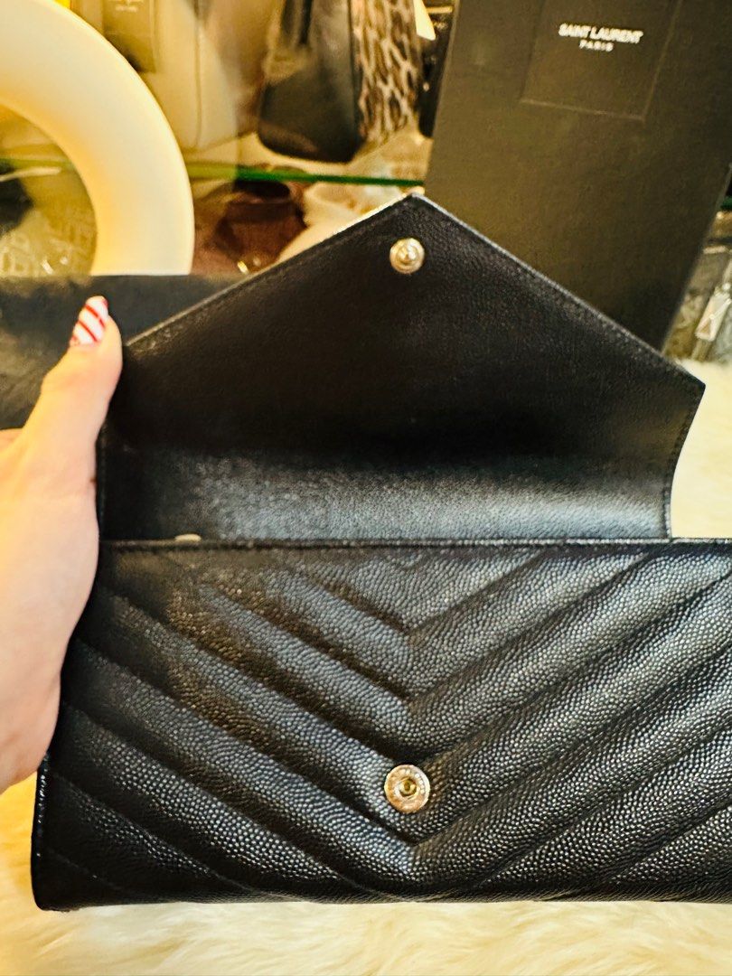 Authentic YSL Grain de Poudre Black Flap Envelope Wallet (Category: Luxury Bags & Wallets) located in Porac. Submitted by bagitupshopph (Listing ID 1339858998, Image 3). Description: Authentic YSL Grain de Poudre Black Flap Envelope Wallet Silver Hardware In very good condition No issues or whatsoever Dimensions 7.5”x4.25 Comes with box and dustbag.