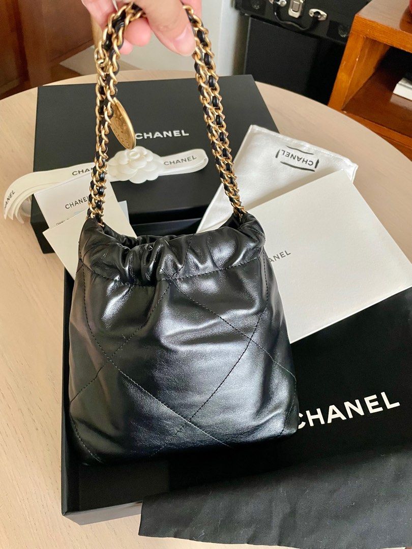 Chanel 22 Mini Bag (Category: Luxury Bags & Wallets) located in Taguig. Submitted by cloudclosetandhome (Listing ID 1414867176, Image 2). Description: Chanel 22 mini in EXCELLENT condition With COMPLETE inclusions (ORIGINAL RECEIPT, Box, Paper bag, Dust bag, ribbon, camellia) Black Calfskin with GHW Microchipped Straight payment only. 📍Location: BGC (can do meet-up) 💵 MOP: Cash, Gcash, BPI, Secbank, or UB.