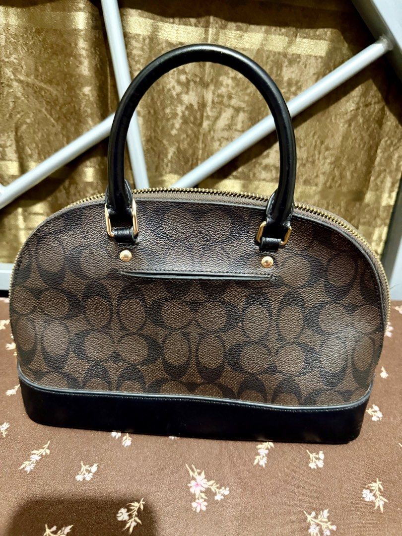 Coach Mini Sierra Satchel (Category: Luxury Bags & Wallets) located in General Trias. Submitted by senorita_0528 (Listing ID 1414893481, Image 3). Description: Preloved Coach Mini Sierra Satchel handbag Signature brown and black design Top handle and detachable strap Black interior with Coach tag Includes Coach hangtag Gold zipper and hardware Can be worn as a crossbody 💯 Authentic ₱2,500.
