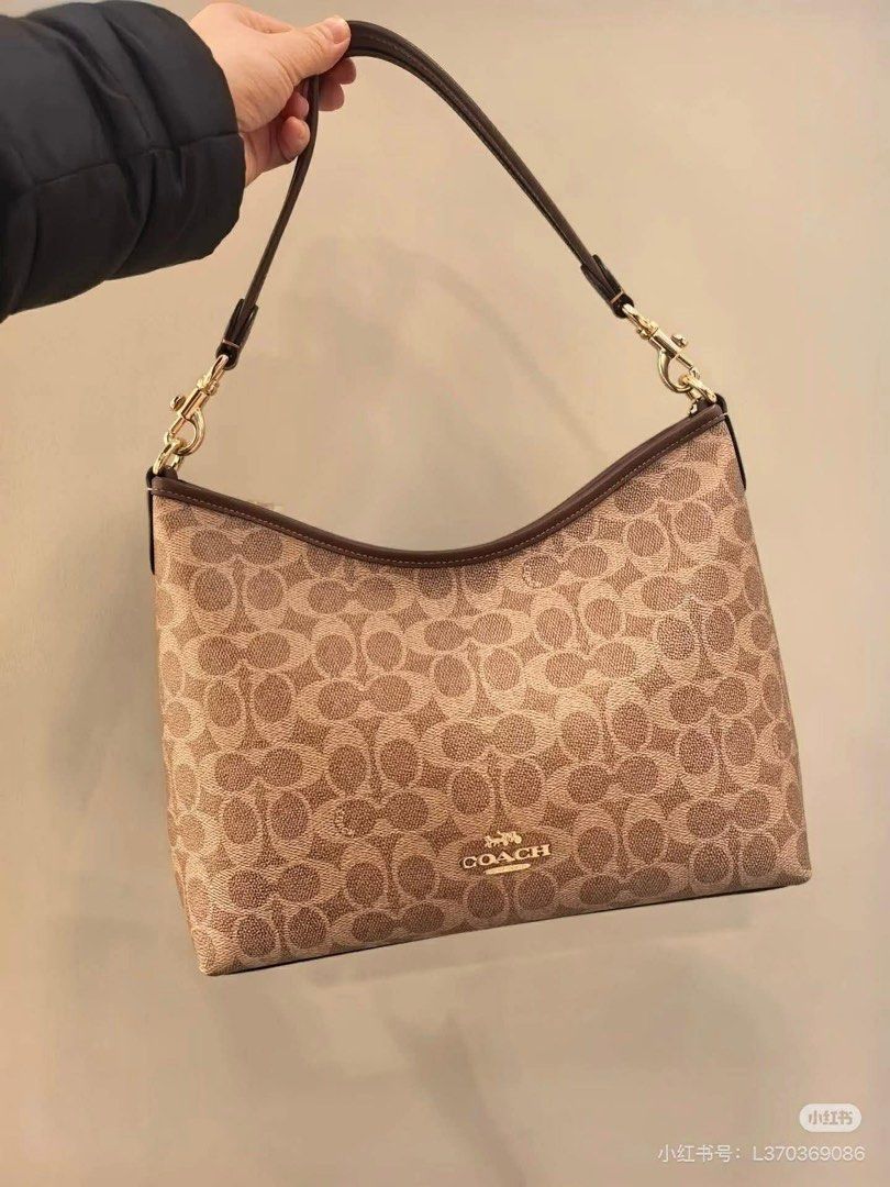 Coach Signature Shoulder Bag (Category: Luxury Bags & Wallets) located in Manila. Submitted by jay_cee241623 (Listing ID 1414882919, Image 1). Description: SUPERSALE COACH BAG 🤩 🖇 3,500+ SF 🖇 💯% Authentic & Brandnew 💯% Complete Inclusions - Coach shoulder bag - Signature Coach pattern - Neutral color - Brown leather strap - Gold-tone hardware - Curved shape - Coach logo on front - Suitable for everyday use.