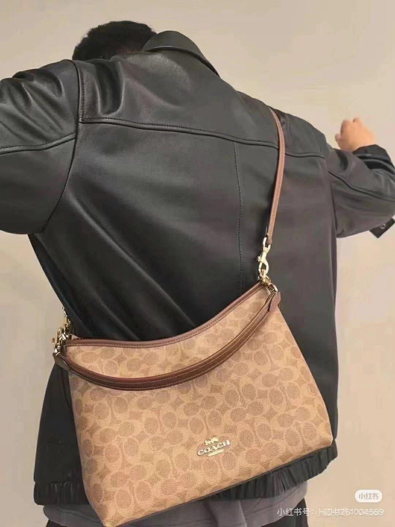 Coach Signature Shoulder Bag (Category: Luxury Bags & Wallets) located in Manila. Submitted by jay_cee241623 (Listing ID 1414882919, Image 3). Description: SUPERSALE COACH BAG 🤩 🖇 3,500+ SF 🖇 💯% Authentic & Brandnew 💯% Complete Inclusions - Coach shoulder bag - Signature Coach pattern - Neutral color - Brown leather strap - Gold-tone hardware - Curved shape - Coach logo on front - Suitable for everyday use.