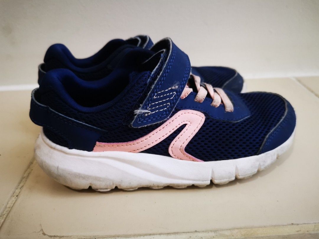 Decathlon Kids' Running Shoes (Category: Babies & Kids Fashion) located in Marilao. Submitted by kshmixnmatch (Listing ID 1414882514, Image 2). Description: - Navy blue and pink Decathlon running shoes for kids. - Easy to wear with hook-and-loop strap. - Pink laces. - White sole. - Size indicated on inner tag. - Shipping fee c/o buyer.