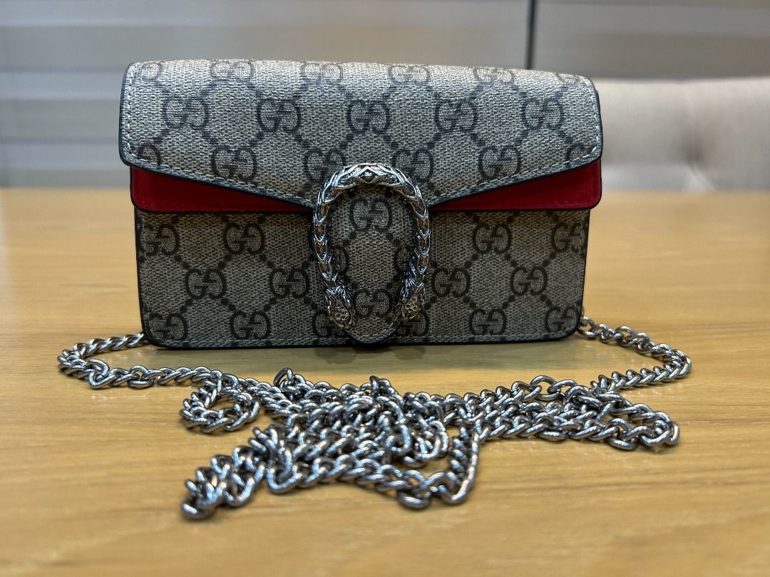 Designer Mini Dionysus Bag with Red Suede Trim (Category: Shoulder Bags) located in Cebu City. Submitted by smartvogue (Listing ID 1414946141, Image 2). Description: Coded Dimensions of bag: 4” H x 6.5” W x 1.5” D Dimensions of box: 5.5” H x 7” W x 2.75” D With dustbag, paperwork, and box Flaw: Minor scuffing on the box, especially at the bottom The item is crafted with great materials and workmanship, but authenticity cannot be guaranteed as pro