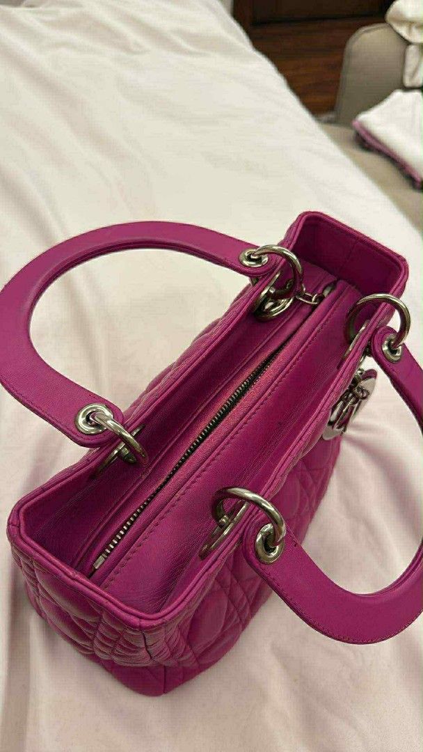 Dior Lady Dior Handbag (Category: Luxury Bags & Wallets) located in Caloocan City. Submitted by quinnnatha63205 (Listing ID 1415005095, Image 3). Description: - Authentic Lady Dior handbag - Stunning pink color - Classic quilted design - Dual top handles - Detachable shoulder strap - Secure zipper closure - Elegant silver-tone hardware - Interior lined with soft gray fabric - Protective metal feet at the base.