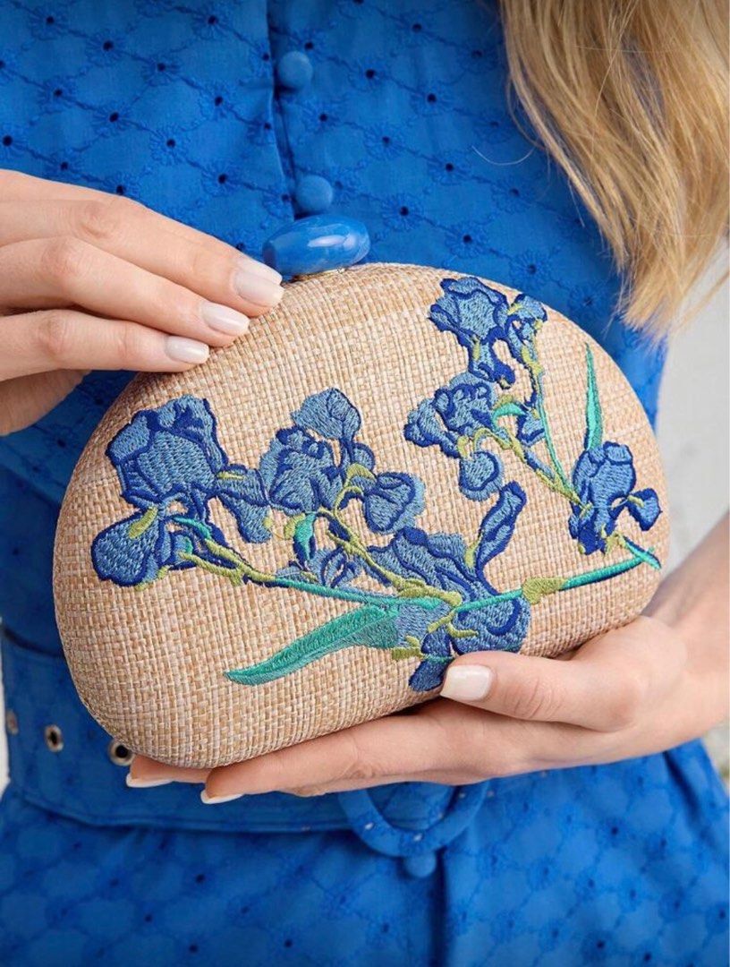 Embroidered Floral Clutch (Category: Clutches) located in Pasig City. Submitted by kathB (Listing ID 1415012611, Image 1). Description: Floral embroidered bag with a woven texture and blue clasp. Perfect size for essentials — phone, lipstick, wipes, etc. Can be carried by hand or worn with a chain, and works well for dressy or semi-formal occasions. Used only once for a wedding. Selling it for less since it loosened a bit after I overpacked it th
