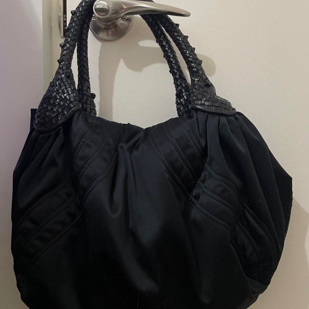 Fendi Spy Bag Silk Black Handbag (Category: Luxury Bags & Wallets) located in Manila. Submitted by lilithru (Listing ID 1414872866, Image 2). Description: - Authentic black Fendi handbag - Woven leather handles and accents - Unique clasp with Fendi logo - Spacious interior - Fendi logo plate inside - "Made in Italy" tag - Includes authenticity tag - Perfect for everyday use -Negotiable -dimensions: 40x28x14 cm (WxHxD).