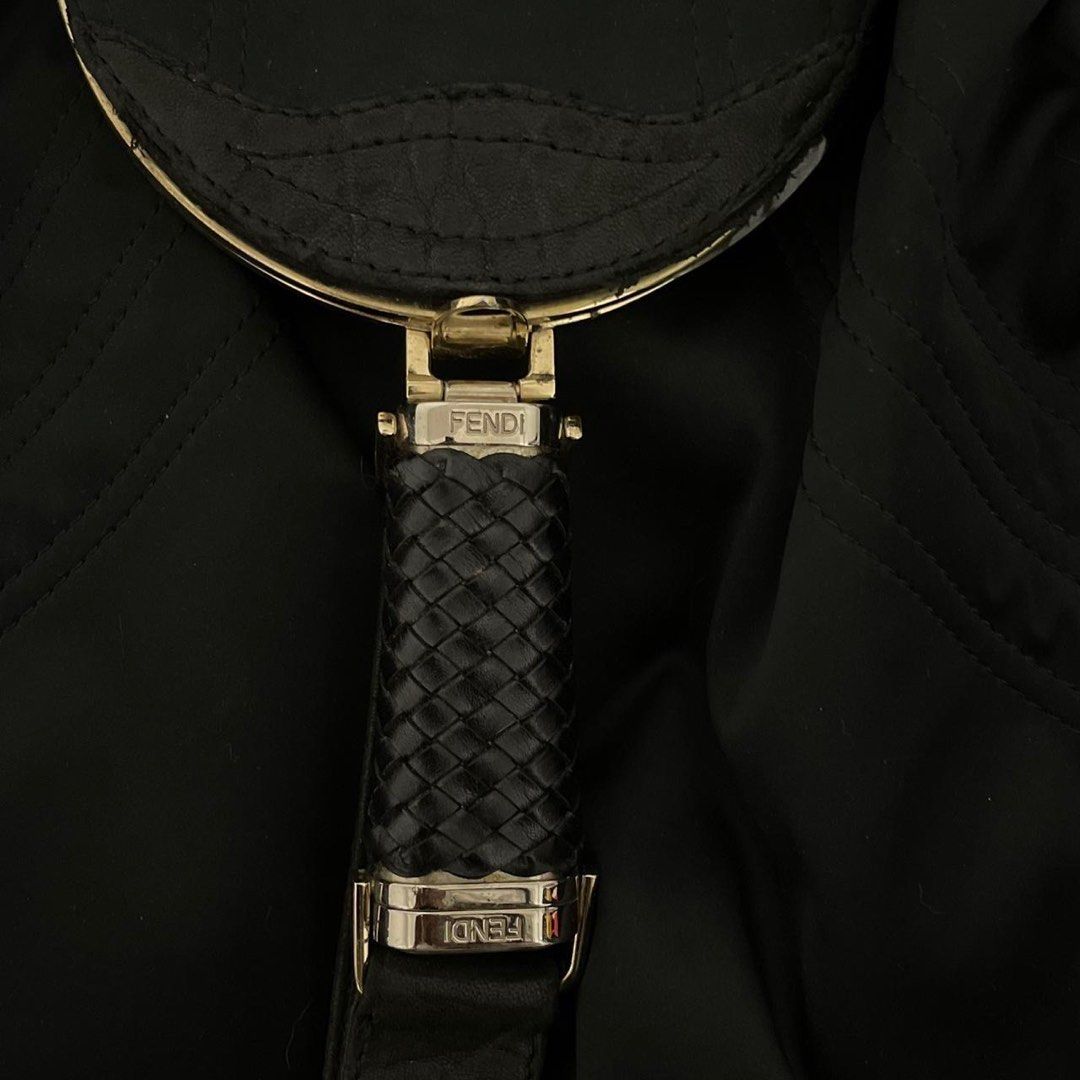 Fendi Spy Bag Silk Black Handbag (Category: Luxury Bags & Wallets) located in Manila. Submitted by lilithru (Listing ID 1414872866, Image 3). Description: - Authentic black Fendi handbag - Woven leather handles and accents - Unique clasp with Fendi logo - Spacious interior - Fendi logo plate inside - "Made in Italy" tag - Includes authenticity tag - Perfect for everyday use -Negotiable -dimensions: 40x28x14 cm (WxHxD).