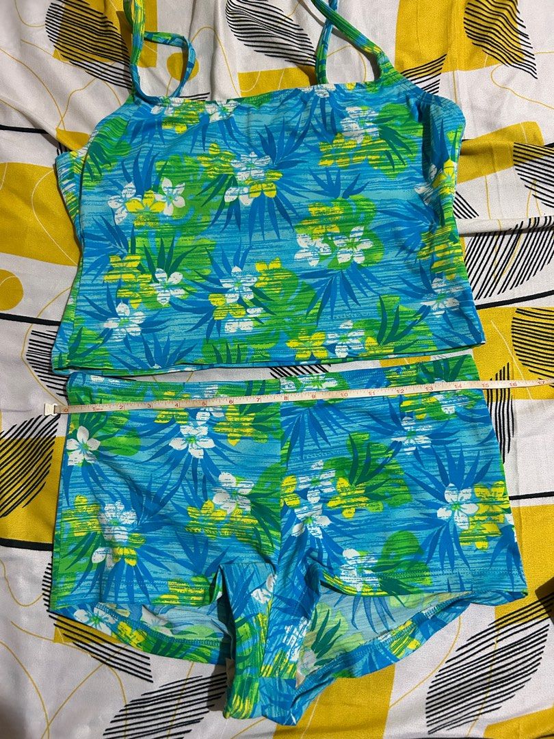 Floral Print Two-Piece Swimsuit (Category: Bikinis & Swimsuits) located in Pasay City. Submitted by volatile.waters (Listing ID 1414850828, Image 3). Description: - Two-piece swimsuit - Vibrant floral print (blue, green, yellow) - Tankini top with spaghetti straps - Comfortable shorts - Top length: 14 inches - Shorts length: 11 inches - Top width: 15 inches.