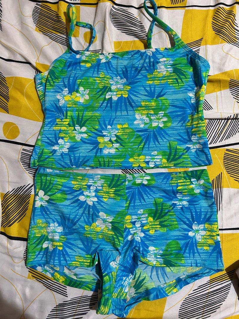 Floral Print Two-Piece Swimsuit (Category: Bikinis & Swimsuits) located in Pasay City. Submitted by volatile.waters (Listing ID 1414850828, Image 1). Description: - Two-piece swimsuit - Vibrant floral print (blue, green, yellow) - Tankini top with spaghetti straps - Comfortable shorts - Top length: 14 inches - Shorts length: 11 inches - Top width: 15 inches.