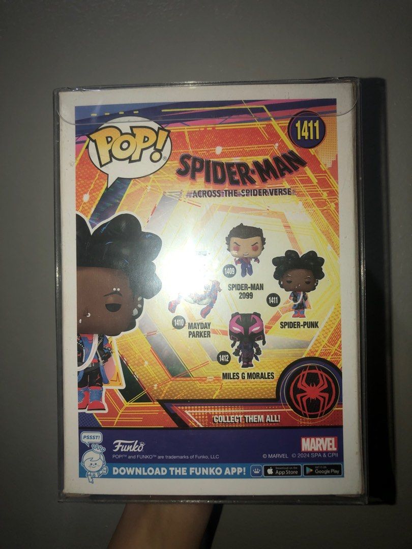 Funko Pop! #1411 Spider-Punk (Category: Designer & Blind Box Toys) located in Manila. Submitted by chlocharlm (Listing ID 1415023604, Image 3). Description: Bobblehead with stand. Never displayed out of box, opened once to check condition. Never displayed without BOSS protector. Comes with BOSS protector. .
