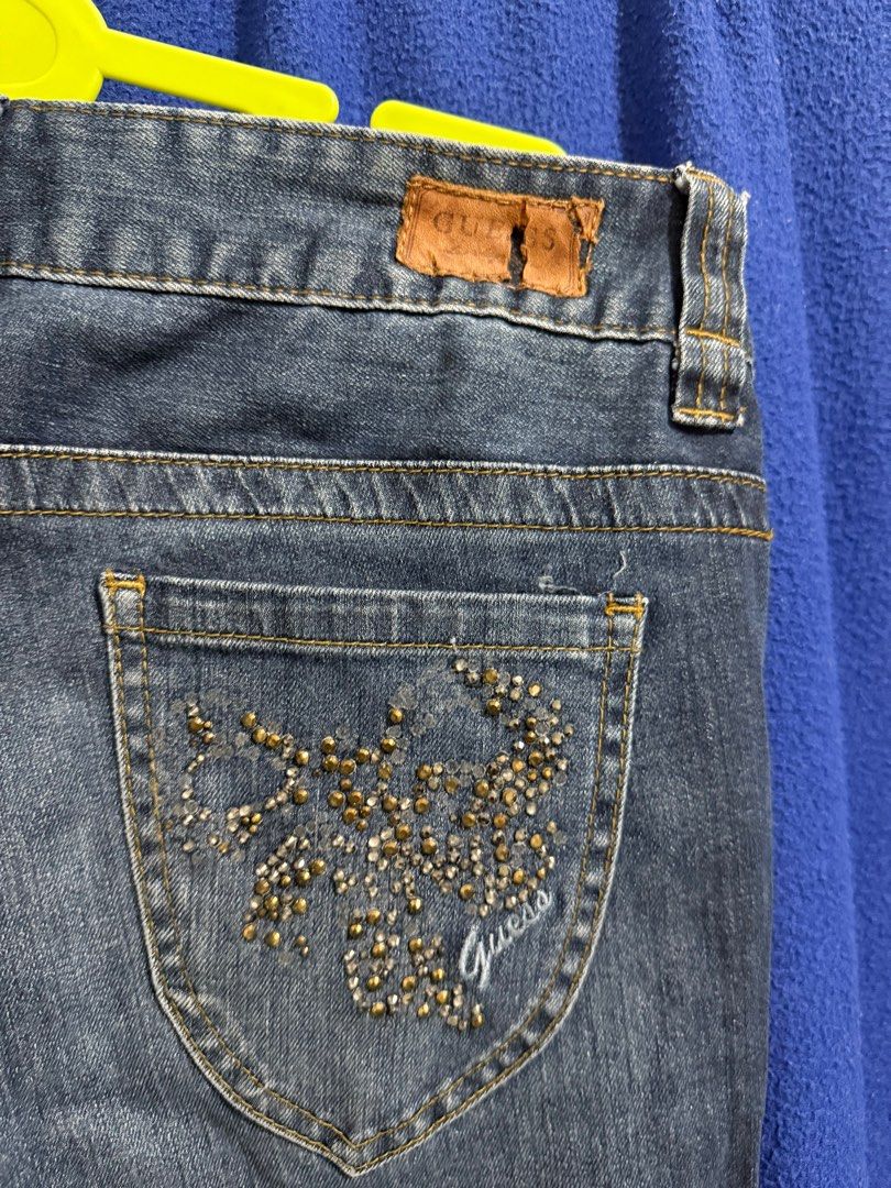Guess Daredevil Skinny Jeans Size 29 (Category: Jeans) located in Cabanatuan. Submitted by declutterpg (Listing ID 1414963545, Image 3). Description: - Guess Daredevil skinny jeans - Dark wash - Size 29 - Decorative design on back pocket - Classic five-pocket design - Button closure with zip fly - 99% cotton, 1% spandex - Guess logo visible.