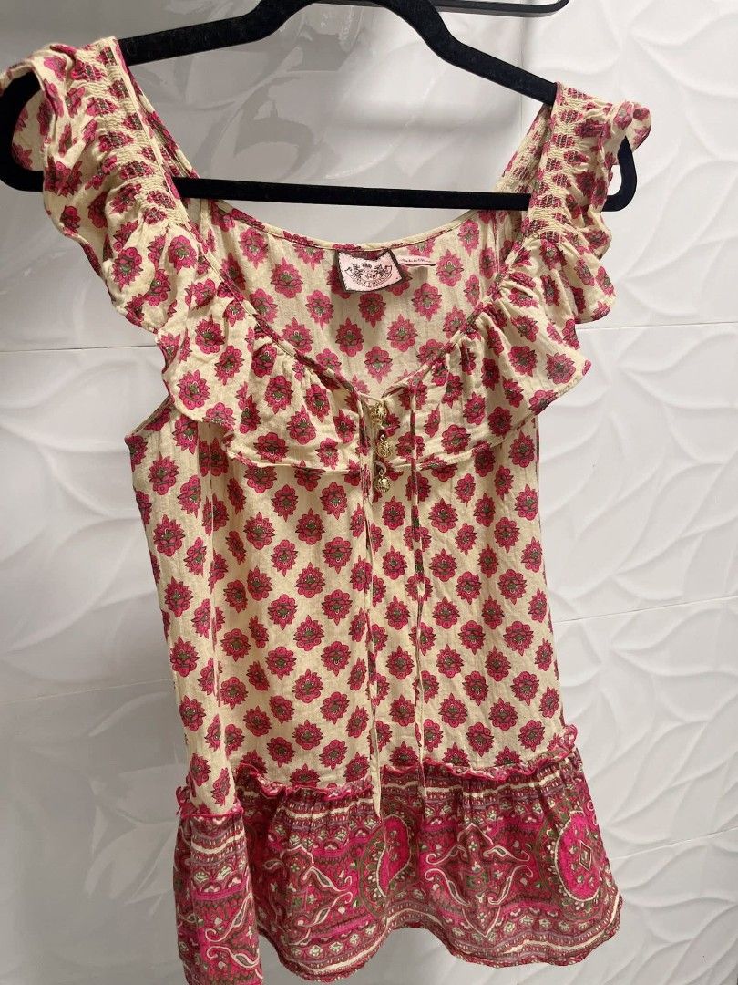 Juicy Couture Floral Top (Category: Sleeveless) located in Manila. Submitted by japan_thrift_surplus (Listing ID 1414877884, Image 3). Description: - Juicy Couture top - Beautiful floral pattern (pink, green, cream) - Unique design with ruffled sleeves - Decorative buttons - Tie-up detail at neckline.