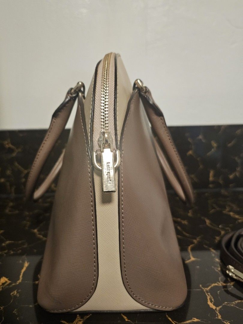 Kate spade alma 2 way (Category: Luxury Bags & Wallets) located in Quezon City. Submitted by le.thriftbags (Listing ID 1414942895, Image 2). Description: 2 way 3 compartments taupe and blush beige colorway medium size preloved rank A.