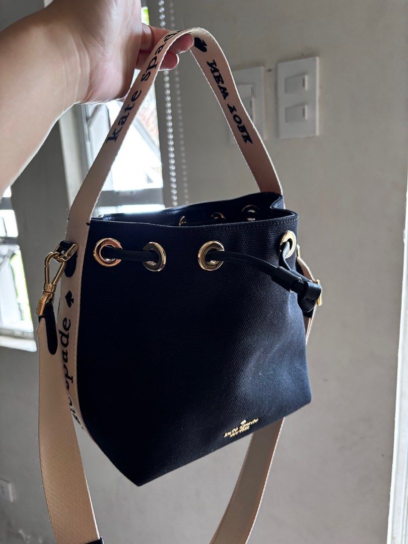 Kate Spade New York Bucket Bag (Category: Luxury Bags & Wallets) located in San Pablo. Submitted by aceastra (Listing ID 1414897403, Image 1). Description: - Kate Spade New York bucket bag - Black exterior - Beige detachable crossbody strap - Drawstring closure - Gold-tone hardware - Interior branded with Kate Spade New York label - Canvas.