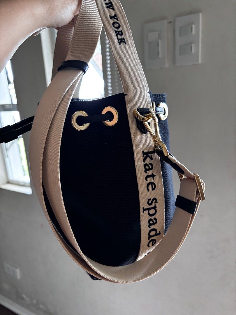 Kate Spade New York Bucket Bag (Category: Luxury Bags & Wallets) located in San Pablo. Submitted by aceastra (Listing ID 1414897403, Image 3). Description: - Kate Spade New York bucket bag - Black exterior - Beige detachable crossbody strap - Drawstring closure - Gold-tone hardware - Interior branded with Kate Spade New York label - Canvas.