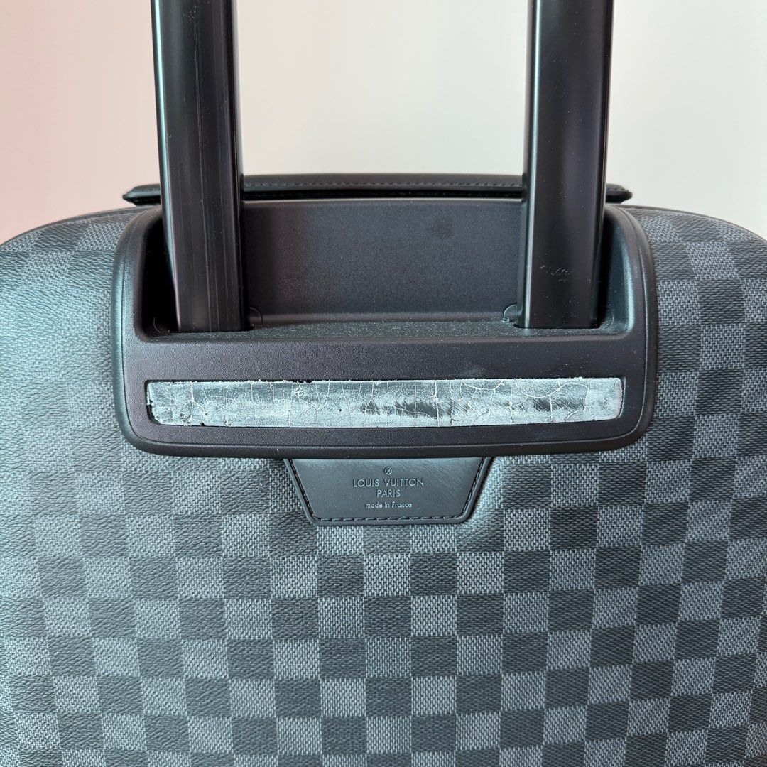 Louis Vuitton Damier Graphite Zephyr 55 Rolling Suitcase (Category: Luxury Bags & Wallets) located in Quezon City. Submitted by prelovedbygirliess (Listing ID 1414847625, Image 3). Description: SRP: PHP 225,000 Material: Damier Graphite coated canvas with leather trim Includes: LV dust bag, Production Year: 2013 Measurements: 14” L x 9” W x 21” H Interior Pockets: Three zip pockets Handles: Retractable handle with leather handle Handle Drop: 22” 