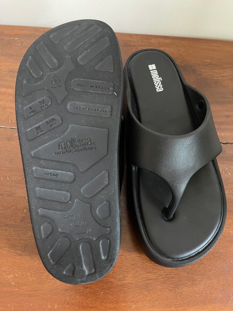 Melissa Black Platform Flip Flops (Category: Flats & Sandals) located in Tacloban City. Submitted by declutterwithbel (Listing ID 1414875281, Image 3). Description: - Black Melissa platform flip flops (bought on PH website) - Thong strap design - Size: 24.5cm | US8 | 39EU | 37BRA - Made in Brazil - Vegan - Very lightweight chunky Y2k style - No box.