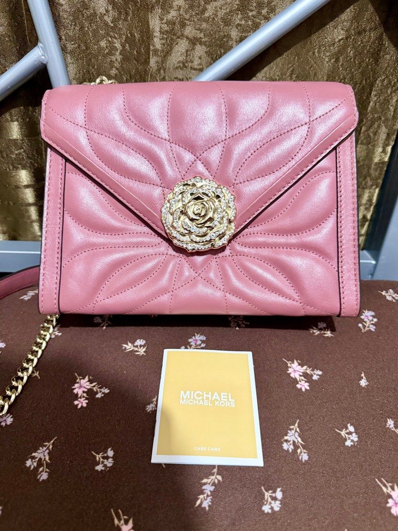 Michael Kors Whitney Large Petal Quilted (Category: Luxury Bags & Wallets) located in General Trias. Submitted by senorita_0528 (Listing ID 1414898874, Image 1). Description: Preloved Michael Kors Whitney Large Petal Quilted Leather Quilted design with rose embellishment Rose-hued color Chain strap and flap closure Interior zippered pocket Includes care card Bought in US Condition: Like new (used once) ₱4,500.