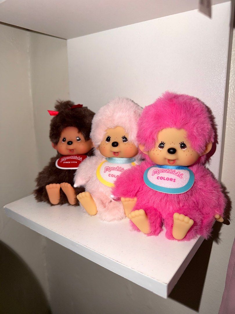 Monchhichi RARE Colors and Original (Category: Plushies & Soft Toys) located in Manila. Submitted by randompicks333 (Listing ID 1414833019, Image 1). Description: - Available in brown, pink, and hot pink Monchhichi plush toys. - Each toy features a bib with the Monchhichi logo. - Brown Monchhichi: Red ribbon. - Pink Monchhichi: Yellow bib. - Hot Pink Monchhichi: Blue bib. - monchichi light pink and hot pink are priced at ₱1,700 - ❌(SOLD HOT PINK)