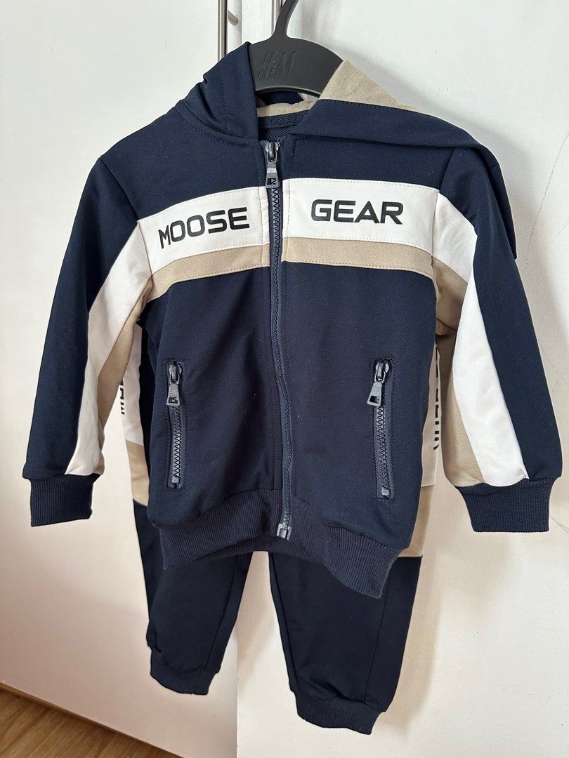Moose Gear Kids' Tracksuit Set (Category: Babies & Kids Fashion) located in San Fernando. Submitted by reynQ (Listing ID 1414867925, Image 1). Description: Used once Size: M - Moose Gear kids' tracksuit set - Includes navy blue zip-up hoodie and matching pants - Hoodie features: - Color block design - Moose Gear brand name on chest - Pants feature: - Elastic waistband with drawstring - Side pockets.