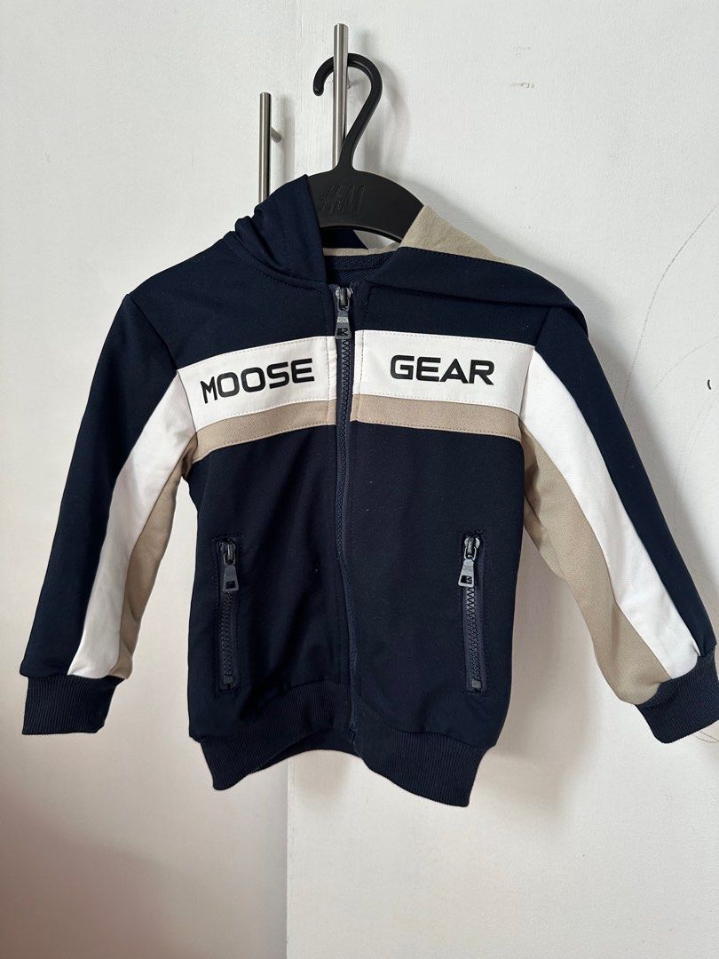 Moose Gear Kids' Tracksuit Set (Category: Babies & Kids Fashion) located in San Fernando. Submitted by reynQ (Listing ID 1414867925, Image 2). Description: Used once Size: M - Moose Gear kids' tracksuit set - Includes navy blue zip-up hoodie and matching pants - Hoodie features: - Color block design - Moose Gear brand name on chest - Pants feature: - Elastic waistband with drawstring - Side pockets.