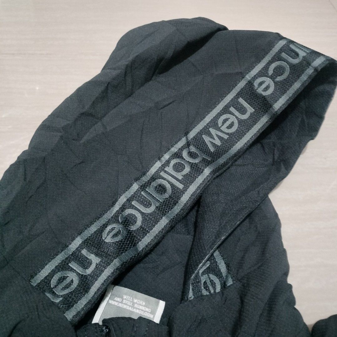 NEW BALANCE RUNNING JACKET (Category: Activewear) located in Sariaya. Submitted by social_animalz (Listing ID 1414941095, Image 3). Description: 22 x 27.5 black color embroidered logo missing drawstring sa hem shipping fee is not included.