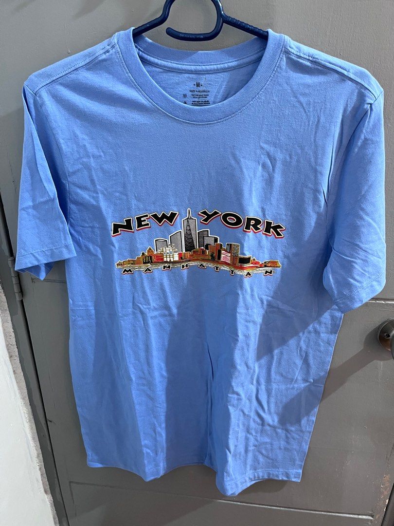 New York Blue shirt size Medium (Category: Tshirts & Polo Shirts ) located in Hagunoy. Submitted by chris.dl (Listing ID 1414912842, Image 1). Description: - New York blue shirt - Size: Medium -Length: 29 inches -Width: 20 inches - Features a New York skyline design.