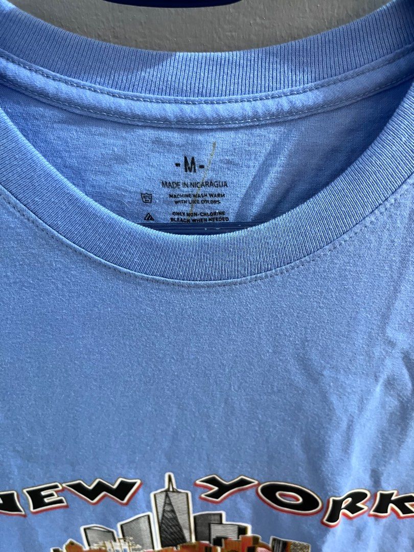 New York Blue shirt size Medium (Category: Tshirts & Polo Shirts ) located in Hagunoy. Submitted by chris.dl (Listing ID 1414912842, Image 2). Description: - New York blue shirt - Size: Medium -Length: 29 inches -Width: 20 inches - Features a New York skyline design.