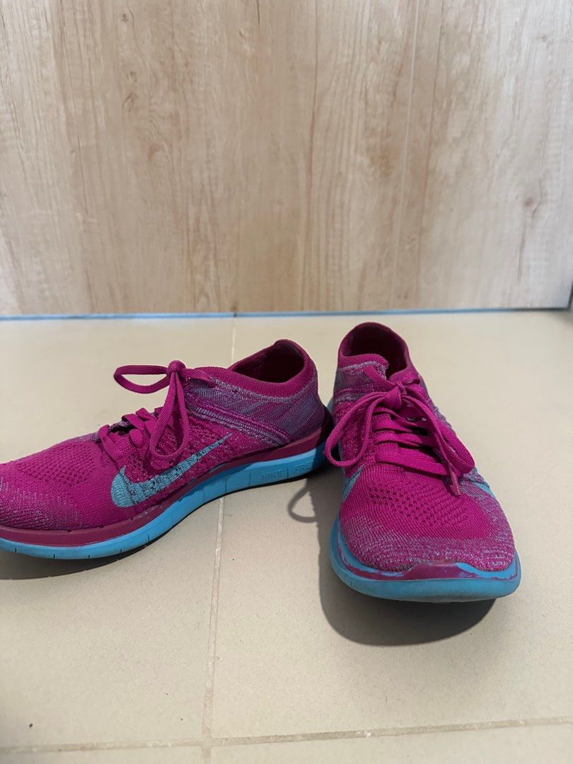 Nike Free RN Flyknit Running Shoes (Category: Sneakers) located in Mandaluyong City. Submitted by kacbriz (Listing ID 1414888945, Image 2). Description: - Nike Free RN Flyknit running shoes - Eye-catching pink and blue color - Breathable Flyknit upper - Flexible sole for comfort - Lace-up closure - Features the Nike swoosh logo - Soles show some wear.
