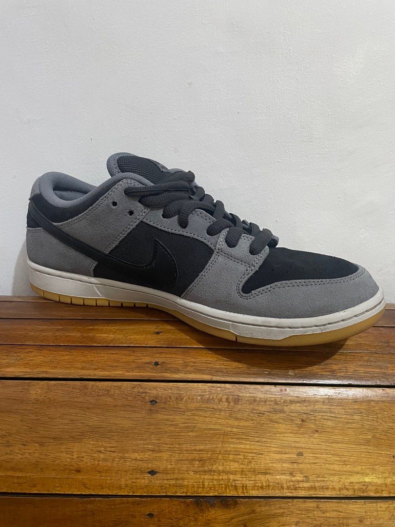 Nike SB Dunk Low Black Grey (Category: Sneakers) located in Manila. Submitted by kad0318 (Listing ID 1414849797, Image 3). Description: - Nike SB Dunk Low - Black and grey colorway - Suede upper - Black swoosh - White midsole - Gum-colored outsole - Nike SB logo on tongue - Minimal sole wear.