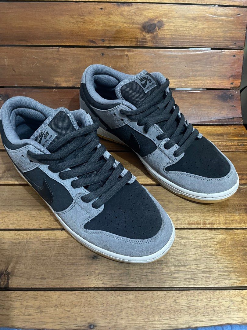 Nike SB Dunk Low Black Grey (Category: Sneakers) located in Manila. Submitted by kad0318 (Listing ID 1414849797, Image 1). Description: - Nike SB Dunk Low - Black and grey colorway - Suede upper - Black swoosh - White midsole - Gum-colored outsole - Nike SB logo on tongue - Minimal sole wear.