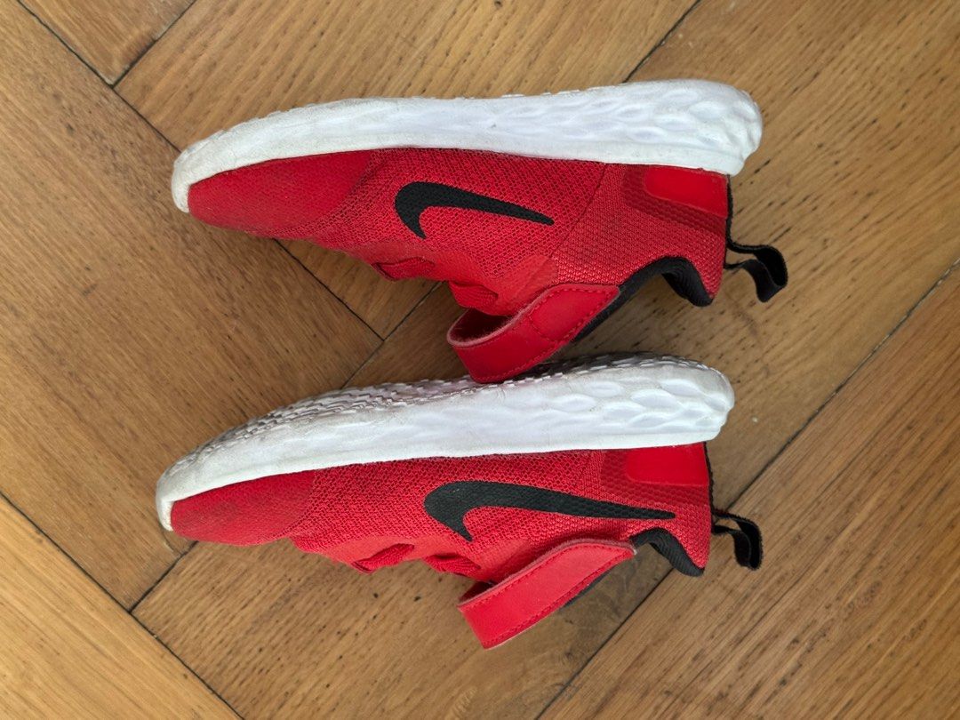 Nike Toddler Shoes Red (Category: Babies & Kids Fashion) located in San Juan City. Submitted by vix13 (Listing ID 1414847854, Image 3). Description: - Nike toddler shoes - Size: US 7C (13cm) - Features: Black Nike swoosh, velcro strap, pull tab at heel - Sole: White - Made in Indonesia - Condition: Shows wear on soles.